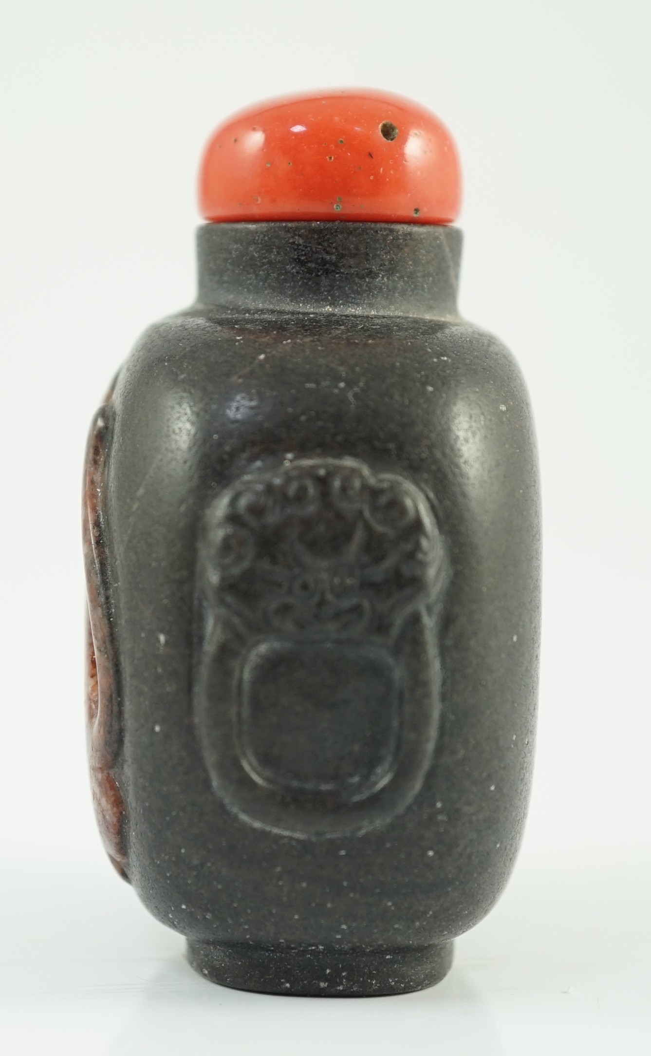 A Chinese two colour marble cameo ‘tiger’ snuff bottle, 19th century, 5.4cm high